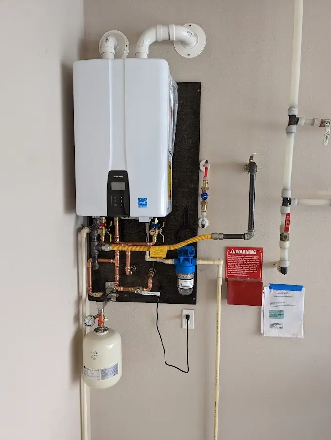 Professional plumber installing copper piping in a Perth home